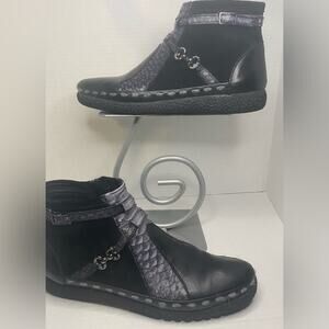 Boots …made in Italy with rubber bottom and pewter buckle detail . Inside zipper